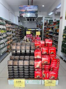 GUJCO Mart store aisle with packaged snacks